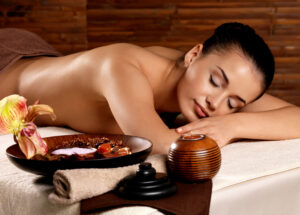 Woman after massage in spa salon -- The Luxury Signature