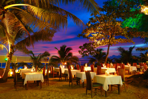 Outdoor restaurant at the beach during sunset Phuket Thailand -- The Luxury Signature